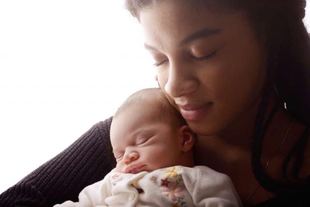 Newborn baby with mother during the photo shoot in Hamburg